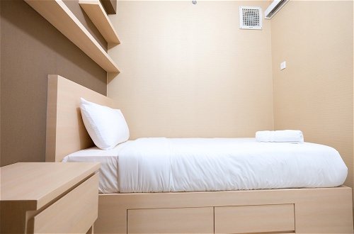 Photo 2 - Modern Minimalist 2 Bedrooms at Bassura City Apartment By Travelio
