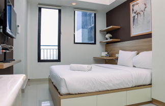 Photo 1 - Comfy Studio Room at Evenciio Margonda Apartment