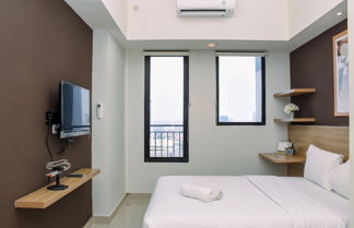 Photo 3 - Comfy Studio Room at Evenciio Margonda Apartment