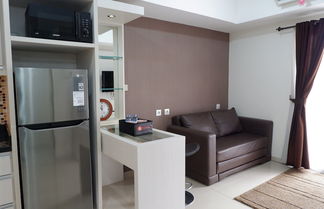 Foto 1 - Homey 1BR at The Wave near Epicentrum Kuningan