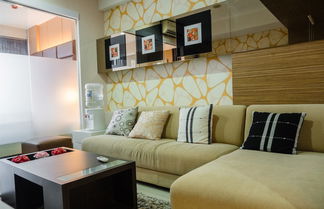 Foto 1 - Luxurious 1BR At Dago Suites Apartment