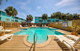 Photo 1 - Serene Condo on the Beach With Pool Covered Deck