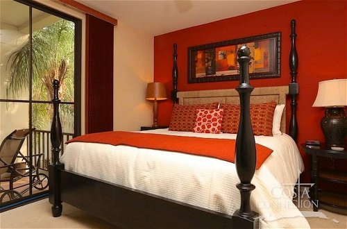 Photo 1 - Impressive 2nd-floor Unit in Coco Done in Red and Orange Hues
