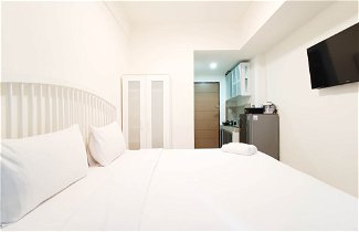 Foto 3 - Cozy And High Floor Studio Room At Vida View Makassar Apartment