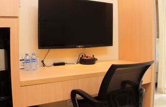 Photo 1 - Comfort Studio Room At Oasis Cikarang Apartment