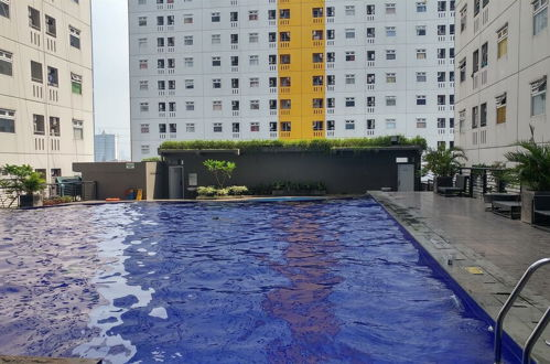 Photo 18 - Furnished Green Pramuka City 2BR Apartment near Mall