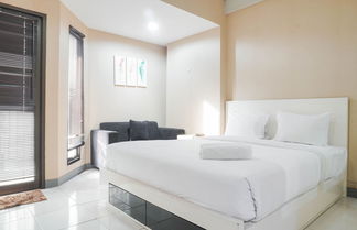 Photo 1 - Cozy Studio Apartment With City View At Tamansari Sudirman