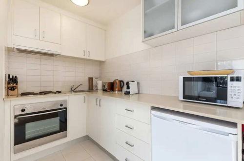 Photo 6 - Prime Location 1 Bedroom Apartment Near MCG With Parking