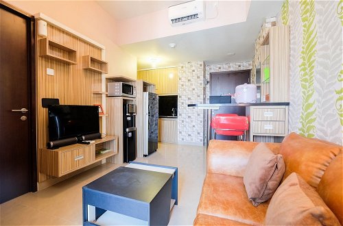 Photo 12 - Cozy 1Br Apartment With Workspace At Mustika Golf Residence