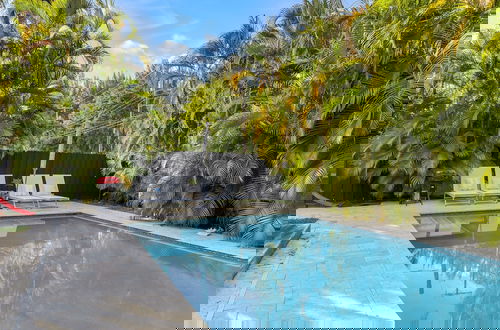 Foto 14 - Poolside Paradise: 4BR w Pool and Mini Playground!