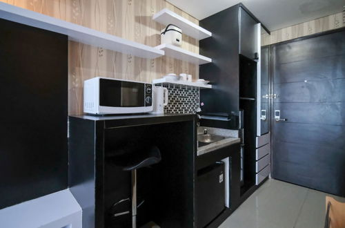Photo 5 - Nice And Clean Studio No Kitchen At Tamansari Papilio Apartment