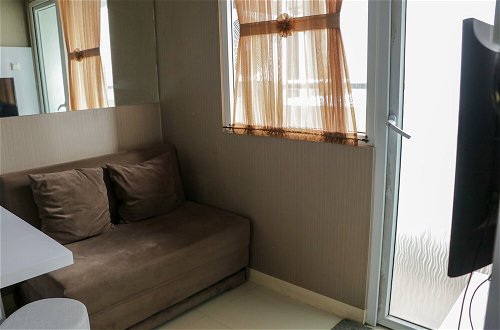 Photo 11 - Homey And Cozy Stay 2Br At Green Pramuka City Apartment