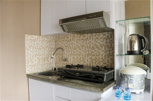 Photo 8 - Homey And Cozy Stay 2Br At Green Pramuka City Apartment