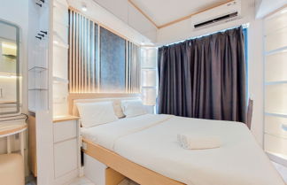 Photo 1 - High Floor And Cozy Studio Room At Sky House Bsd Apartment