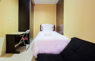Photo 2 - Modern 2BR at City Home Apartment with Sofa Bed near MOI