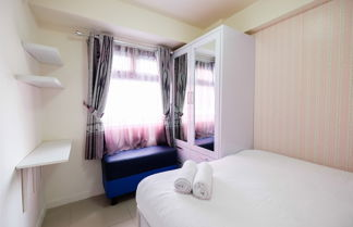 Photo 3 - Comfort 2BR with Pool View Green Pramuka City Apartment