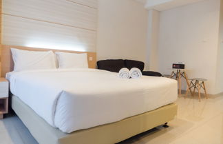 Photo 3 - Comfy Studio At Dago Suites Apartment