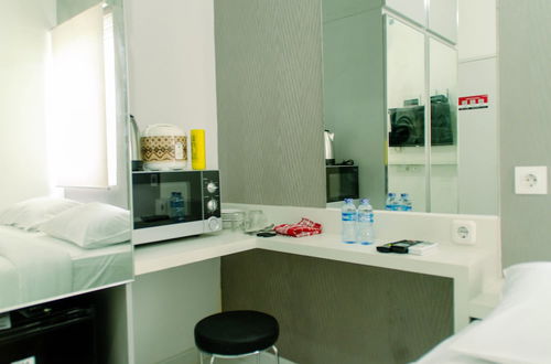 Photo 12 - Cozy Studio Apartment At Aeropolis Residence Near Cgk Airport