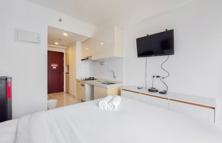 Photo 2 - Cozy Style Studio Room At High Floor Sky House Bsd Apartment