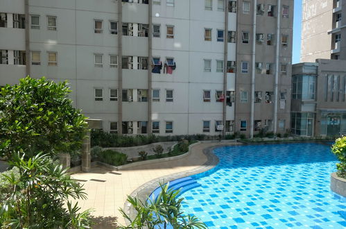 Photo 13 - Clean And Comfy 2Br Apartment At Puncak Kertajaya