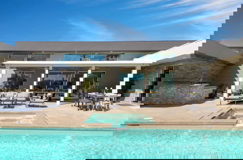 Foto 26 - Sleeps 28! 2 Luxe Villas w/ Pool & Putting Green Polo Villas Nova by Avantstay