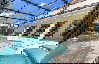 Foto 2 - Beautiful 9 bedroom pool home located in the Solterra Resort! 9 Home by RedAwning