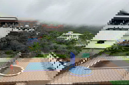Foto 9 - Sky High By Joy Suites