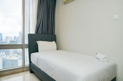 Photo 5 - Comfortable Deluxe 2BR at The Empyreal Condominium Epicentrum Apartment By Travelio