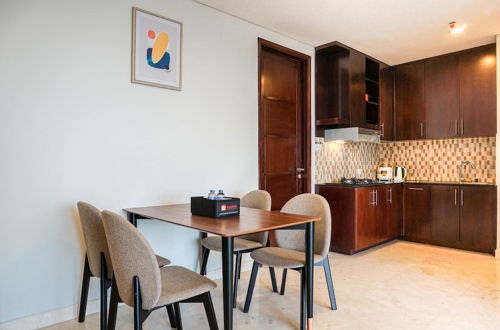 Photo 10 - Comfortable Deluxe 2BR at The Empyreal Condominium Epicentrum Apartment By Travelio