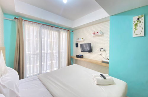 Photo 3 - Modern and Comfy Studio Room at Grand Asia Afrika Apartment