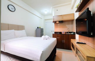 Photo 3 - Studio Room at Green Pramuka City Apartment with Mall Access By Travelio