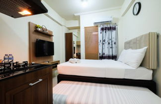 Photo 1 - Studio Room at Green Pramuka City Apartment with Mall Access By Travelio
