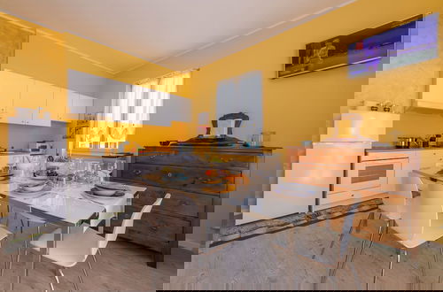 Foto 5 - La Maison Fleurie Appartamento Giglio
