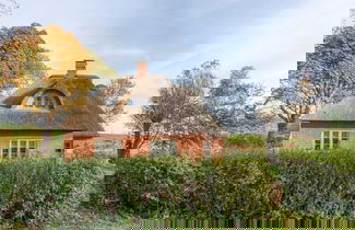 Foto 1 - Reetgedecktes Ferienhaus mit Kachelofen