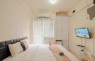 Foto 3 - Cozy Studio with Direct Access to Mall at Green Pramuka Apartment