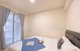 Photo 2 - Modern 2BR Room at Meikarta Apartment By Travelio