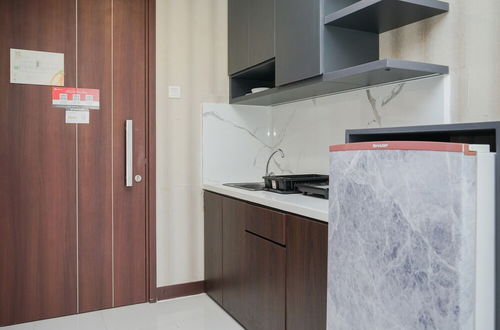 Photo 3 - Cozy Design 1Br Apartment At Scientia Residence