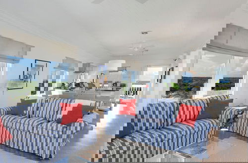 Photo 4 - Coastal Haven: Charming Beachfront Cottage With Pool