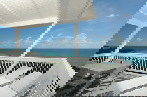 Photo 12 - Coastal Haven: Charming Beachfront Cottage With Pool