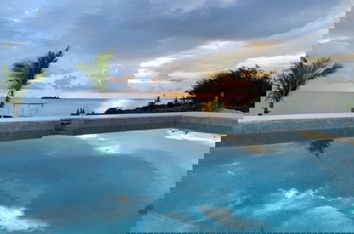 Photo 10 - Oceanfront Elegance: New Home With Dock, Kayaks, And Pool