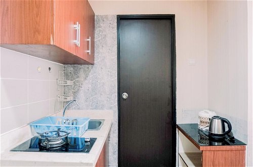 Photo 9 - Great Deal And Homey 1Br Apartment Belmont Residence Puri