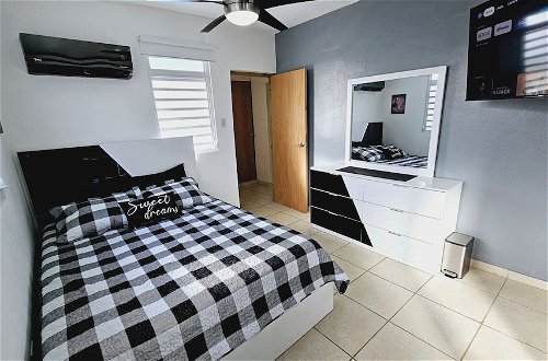 Photo 9 - Cozy and Modern Apartment Black & White With Jacuzzi on Terrace