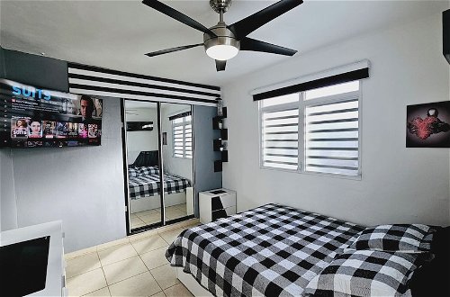 Photo 2 - Cozy and Modern Apartment Black & White With Jacuzzi on Terrace
