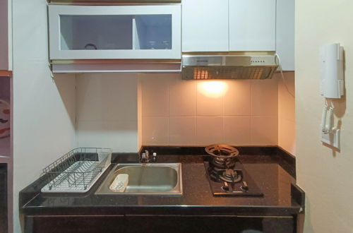 Foto 4 - Simply 1Br At 31St Floor Vida View Makassar Apartment