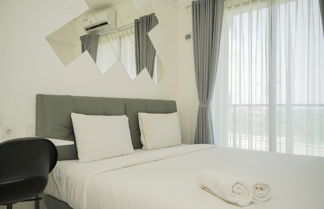 Photo 1 - Nice And Homey Studio Room At Sky House Bsd Apartment