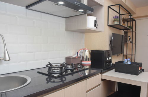 Photo 6 - Enjoy Living And Tidy 1Br Bassura City Apartment