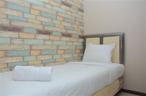 Foto 2 - Comfortable 2BR at Green Pramuka City Apartment Direct Access to Mall
