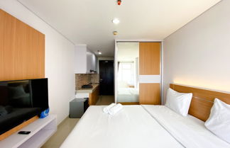 Photo 1 - Nice And Comfy Studio At Enviro Apartment