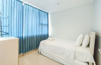 Photo 2 - Tranquil Designed 2Br Apartment Dago Suites