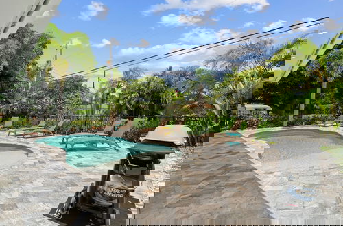 Photo 39 - Sardinia Vacation Rental: Delightful Coastal Home near Vanderbilt Beach. Relax in a Private Pool and Spacious 4-BR Retreat with Modern Amenities. Ideal for Families. Minutes from Mercato and Local Attractions